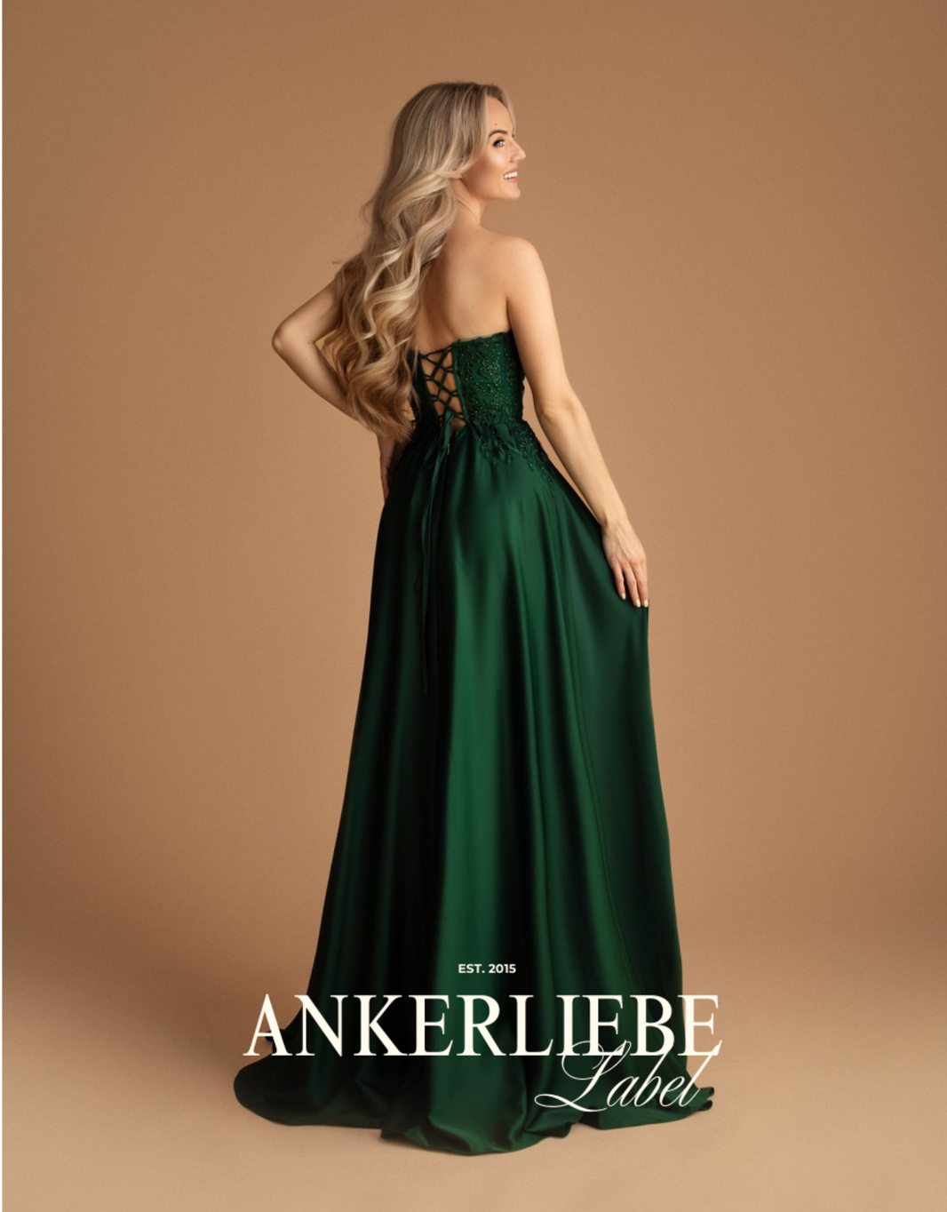 image abendkleid mit transparenter corsage, rückenschnürung und beinschlitz | smaragd